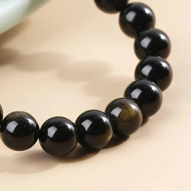 Artisan d'Asie Bracelets Malas Bracelet mala en pierre d'obsidienne dorée