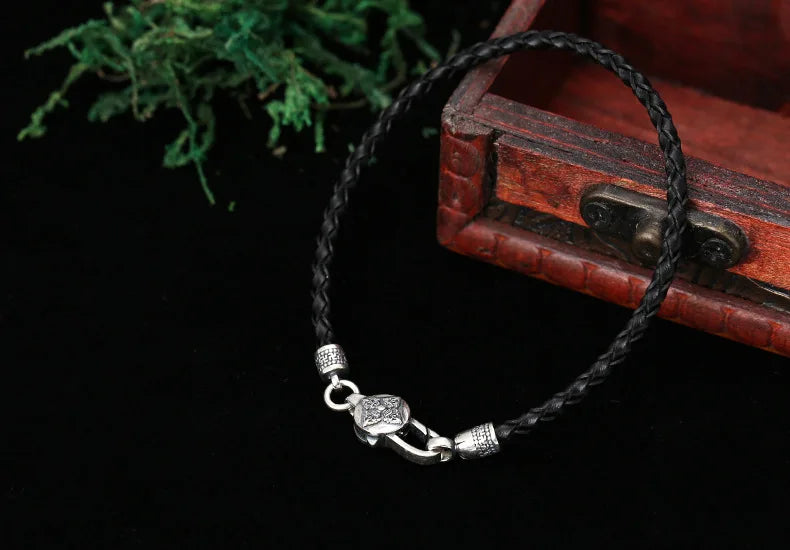 Artisan d'Asie Bracelets Tressés Tibétains Bracelet en argent sterling 925 et cuir tressé – Six Mantras & Vajra Pestle