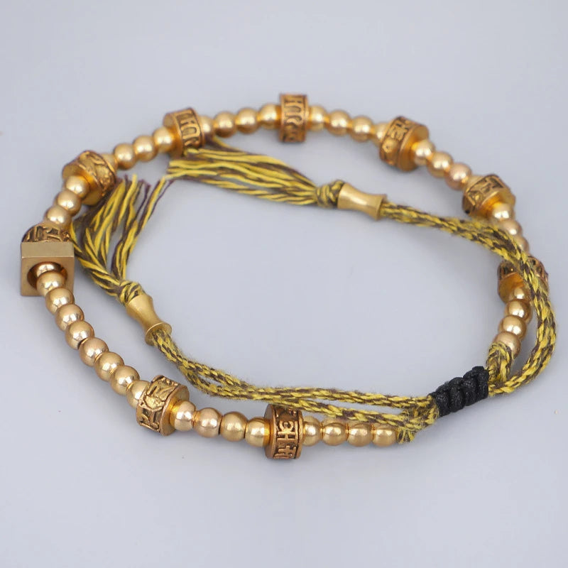 Artisan d'Asie Bracelets Tressés Tibétains Bracelet tibétain tressé à la main avec perles en cuivre tibétaines