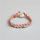 Bracelet Tibétain tressé à la main multicolore avec une amulette aux choix Bracelets Tressés Tibétains Artisan d'Asie